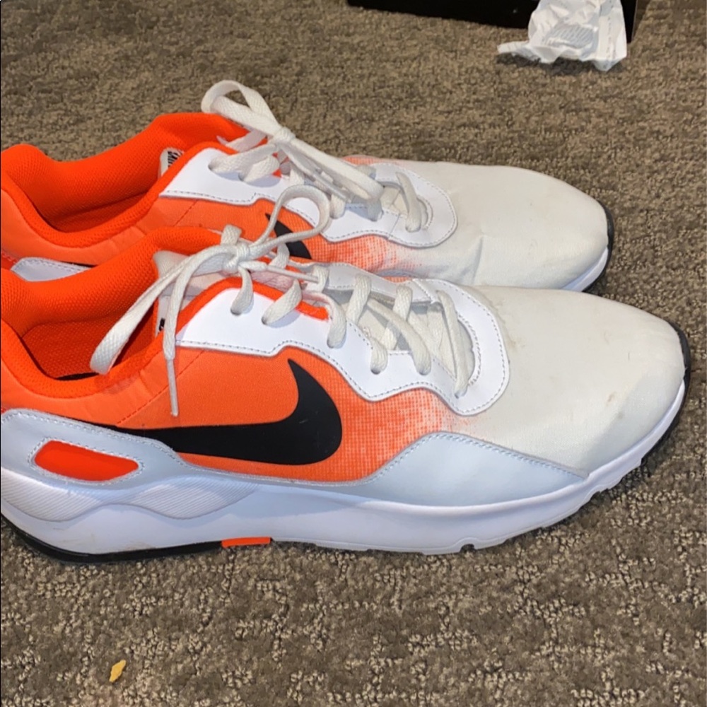 White and orange everyday use Nike shoes